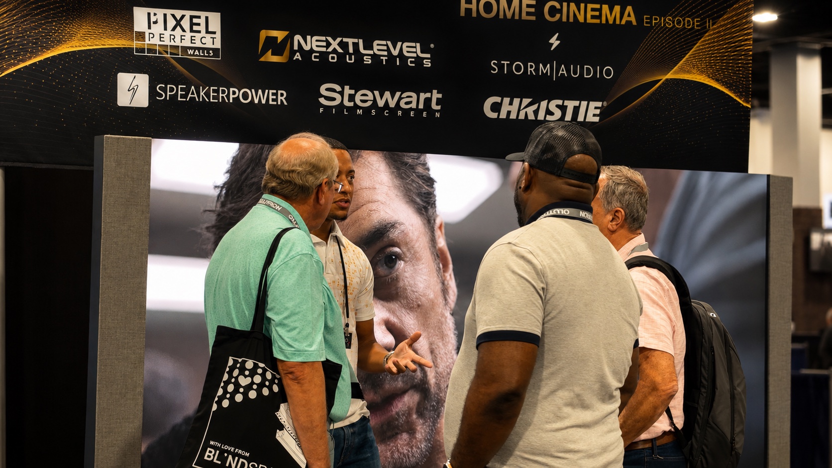 Pixel Perfect Walls representative speaking with technology dealers at a professional trade show